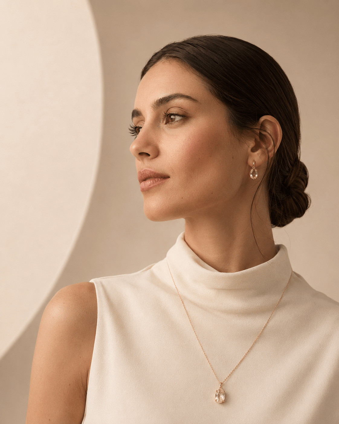 Woman wearing a RANDILU GEMS pendant and earrings